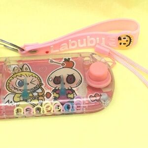 Labubu water and keychain set. New